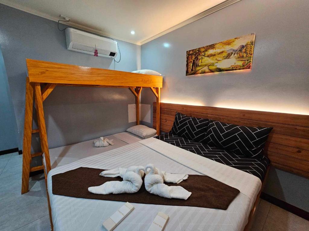 Postel nebo postele na pokoji v ubytování La Choeben Suites