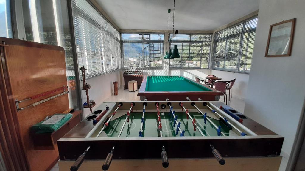 a large room with a ping pong table in it at Villa Madonna con le rose Sala Giochi e Biliardo in Camaiore