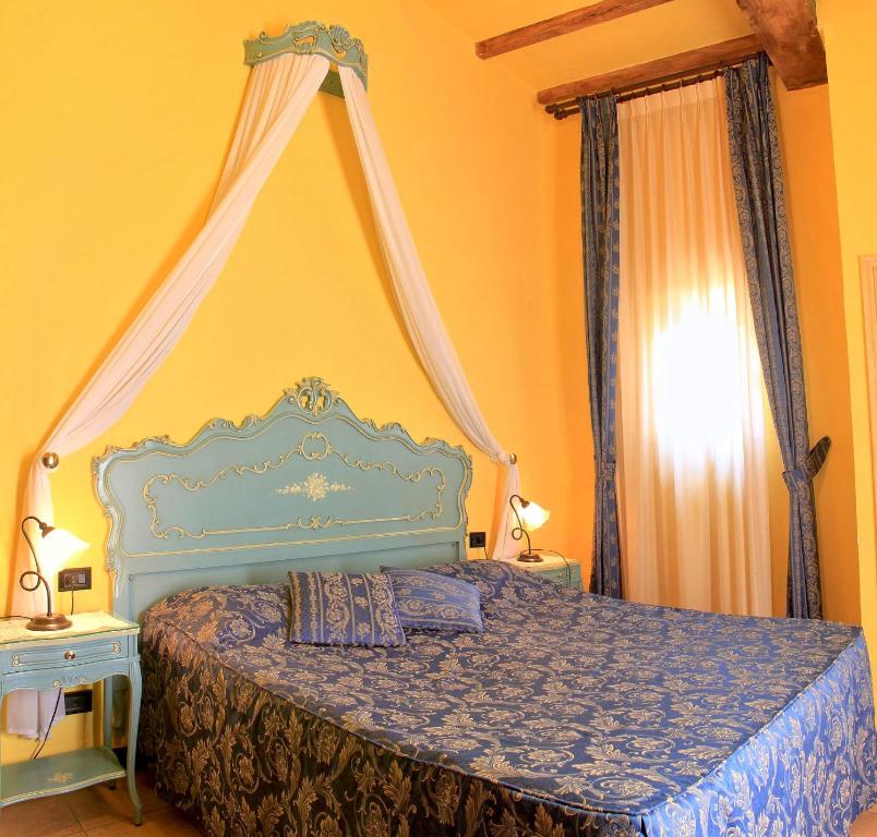 Postel nebo postele na pokoji v ubytování La Terrazza Di Montepulciano