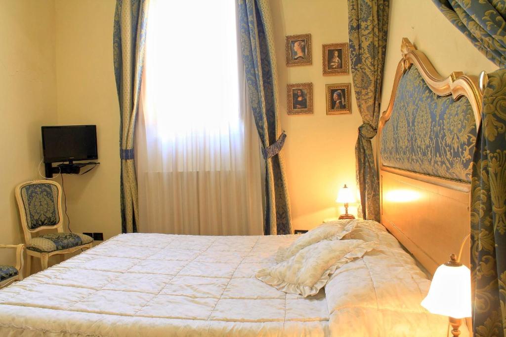Postel nebo postele na pokoji v ubytování La Terrazza Di Montepulciano