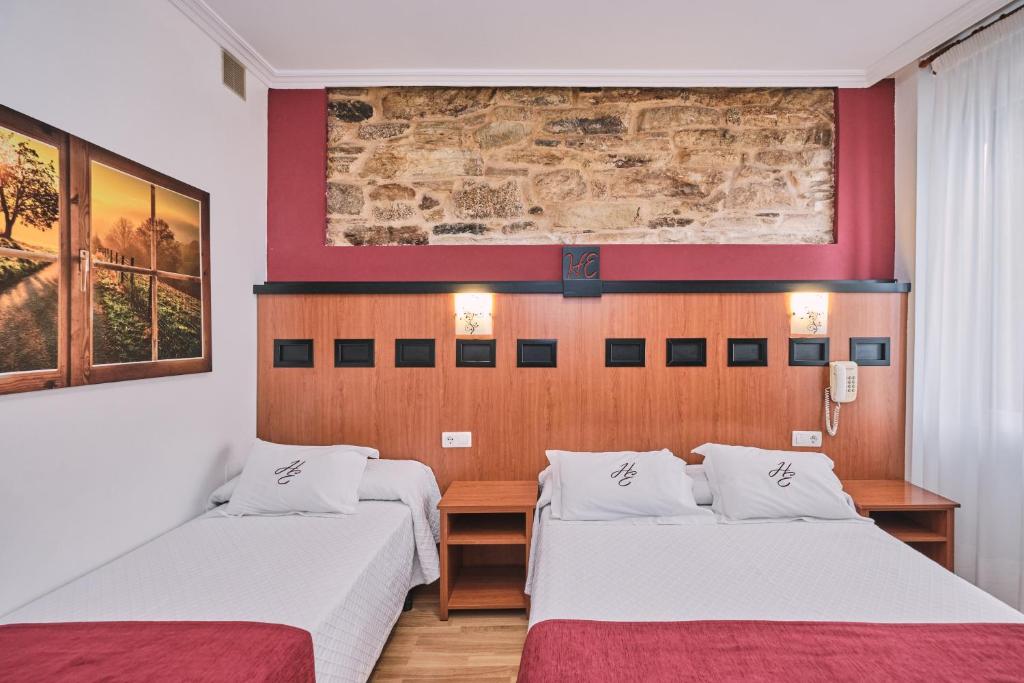 Postel nebo postele na pokoji v ubytování Hotel Entrecercas