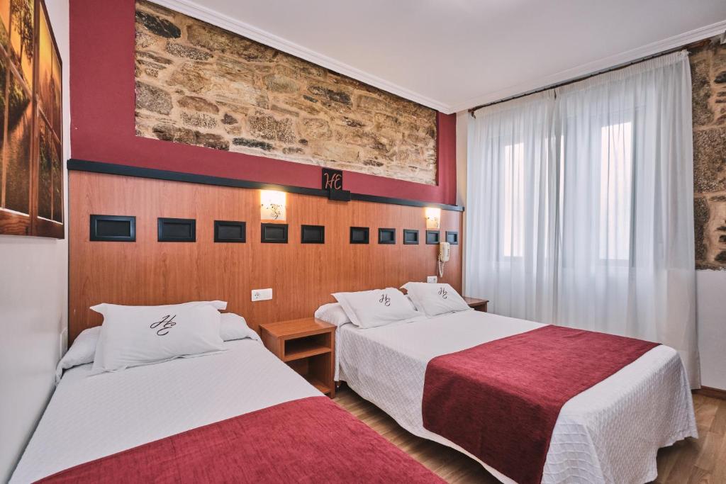 Postel nebo postele na pokoji v ubytování Hotel Entrecercas