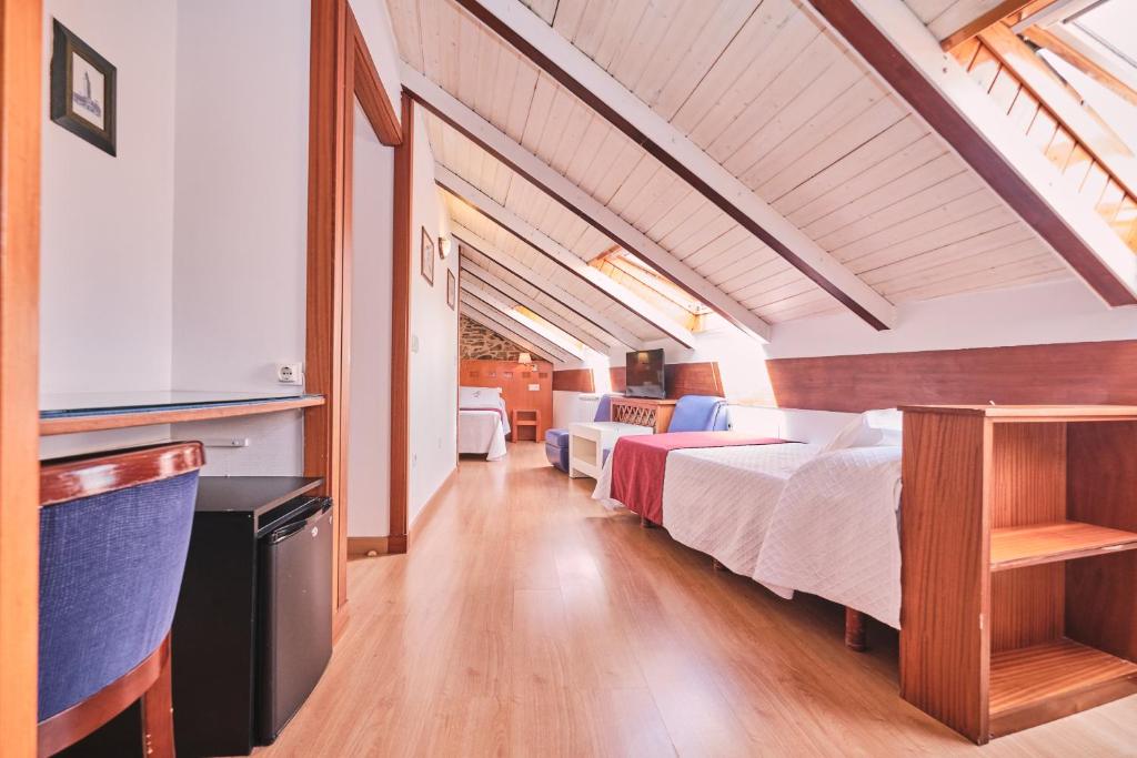 Postel nebo postele na pokoji v ubytování Hotel Entrecercas