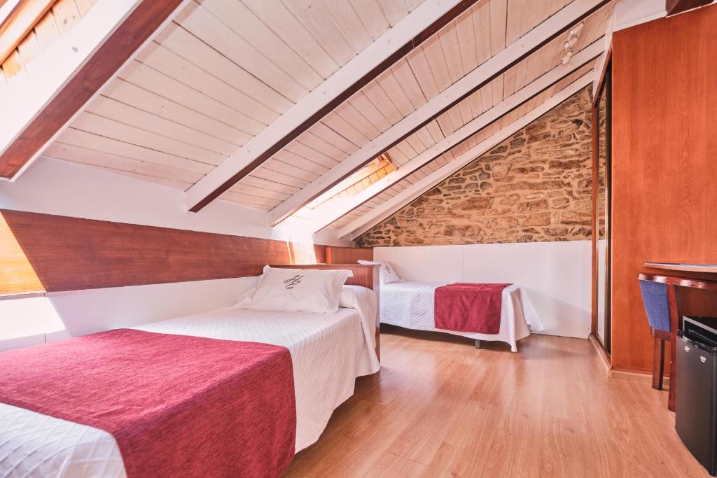 Postel nebo postele na pokoji v ubytování Hotel Entrecercas