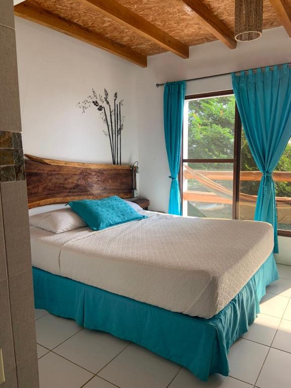 Postel nebo postele na pokoji v ubytování Hotel Nantu Hostería