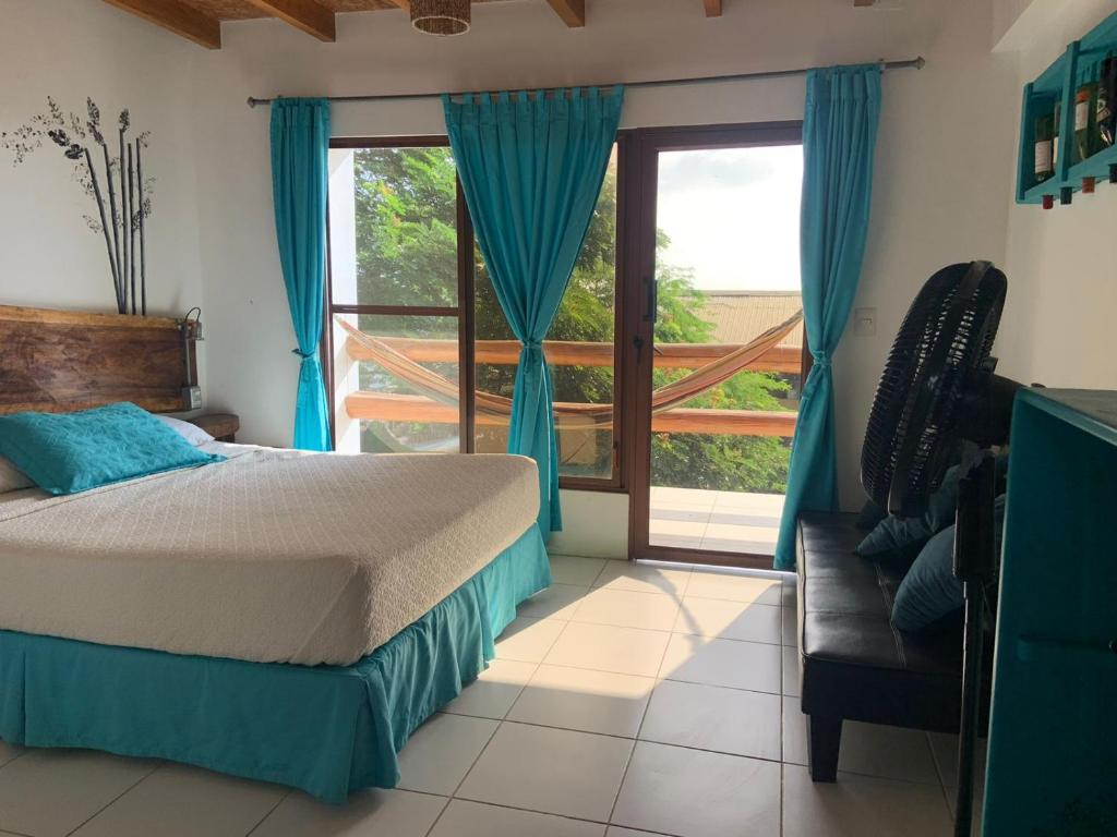 Postel nebo postele na pokoji v ubytování Hotel Nantu Hostería