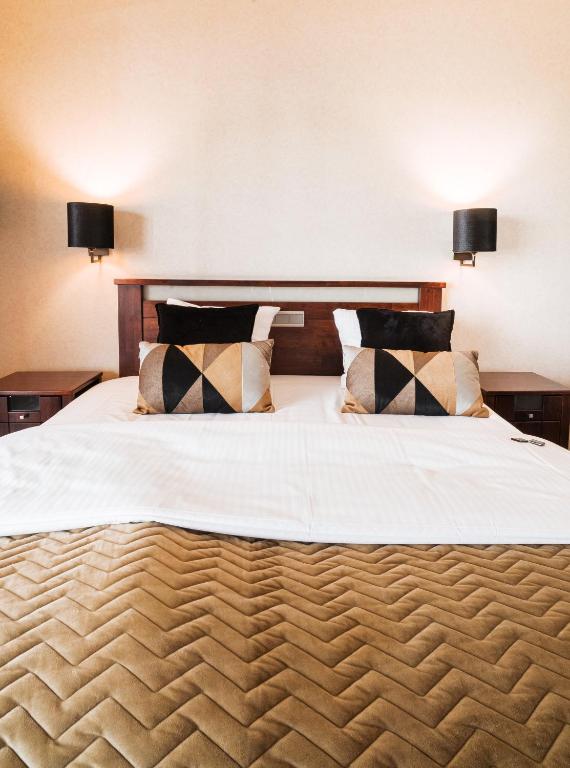 Postel nebo postele na pokoji v ubytování Turnhout City Hotel