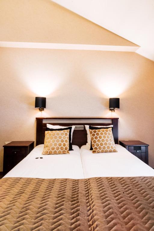 Postel nebo postele na pokoji v ubytování Turnhout City Hotel