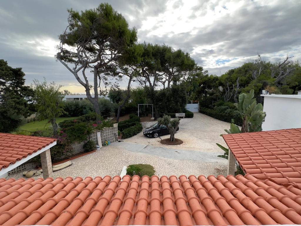 a view of a house with a red roof at Villa Paola by the sea in Cozze