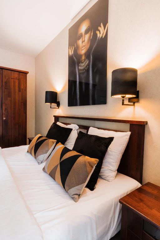 Postel nebo postele na pokoji v ubytování Turnhout City Hotel