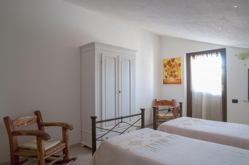 Postel nebo postele na pokoji v ubytování B&B Le Fresie