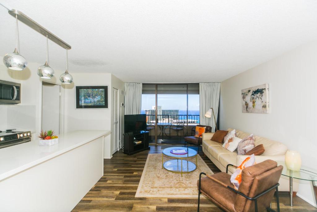 a living room with a couch and a table at Discovery Bay 3513 in Honolulu