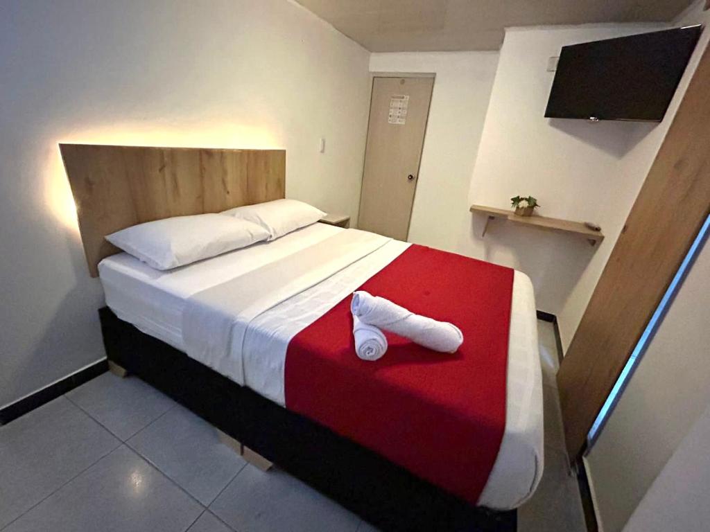 Postel nebo postele na pokoji v ubytování Hotel Urban Center Bogota