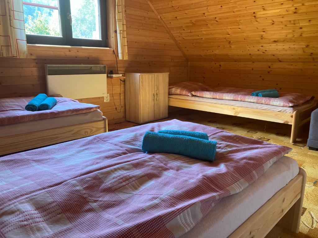 Postel nebo postele na pokoji v ubytování Chalupa Nella