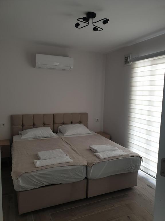a bedroom with a large bed with a ceiling fan at Dalaman no 444 in Dalaman