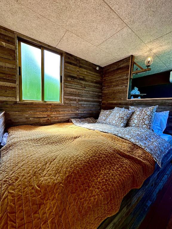 Voodi või voodid majutusasutuse Krusmølle Glamping toas