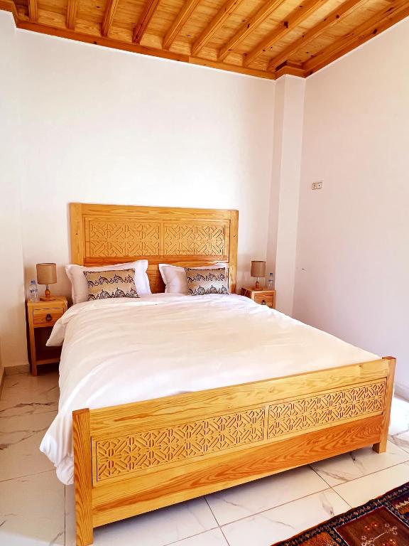 Postel nebo postele na pokoji v ubytování Riad Al Manara