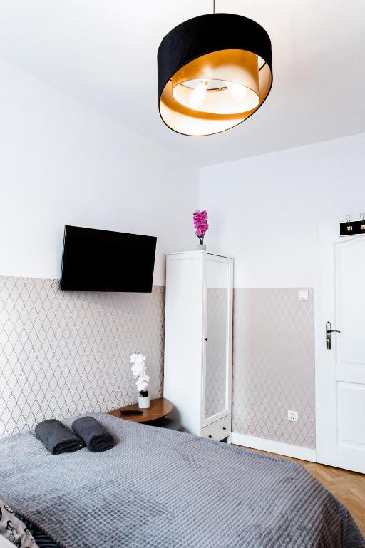 Posteľ alebo postele v izbe v ubytovaní ClickTheFlat Krucza City Center Apart Rooms