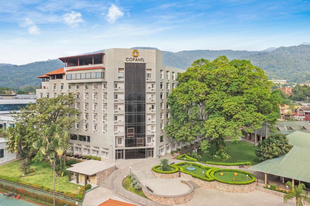 an aerial view of a hotel with a tree at Copantl Hotel & Convention Center in San Pedro Sula