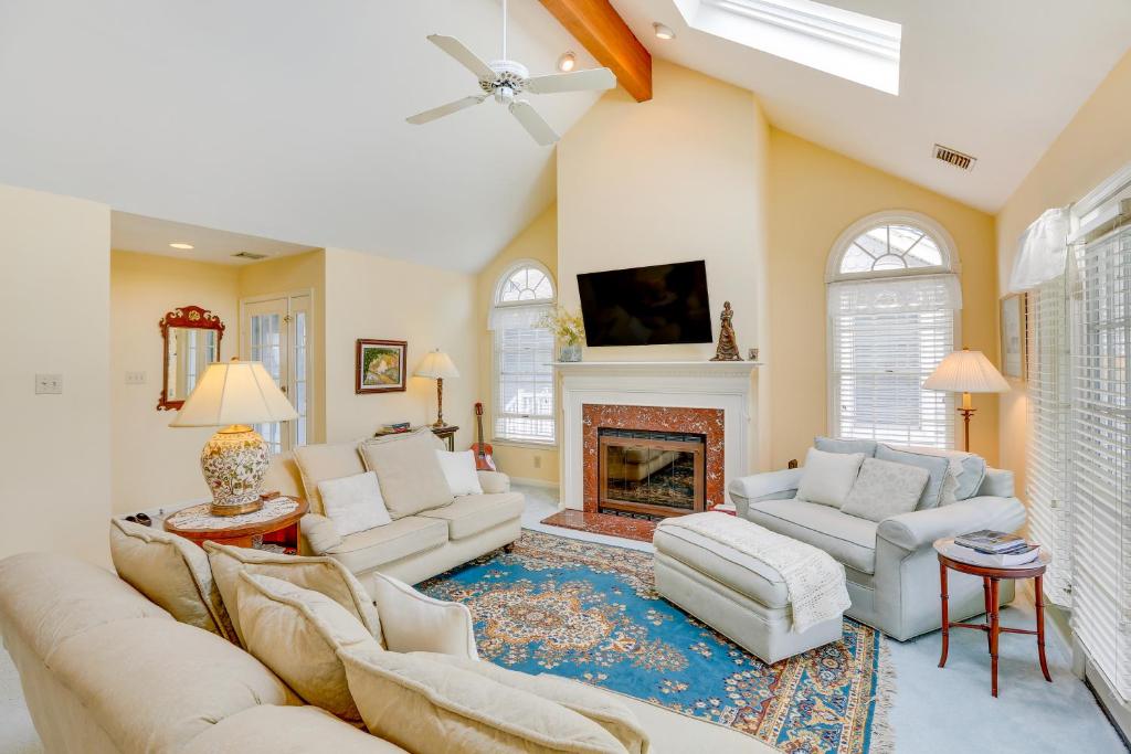 a living room with two couches and a fireplace at Ocean City Home 1 Block to Beach and Boardwalk! in Ocean City