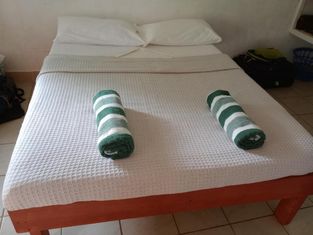 Postel nebo postele na pokoji v ubytování Kathy B Guesthouse