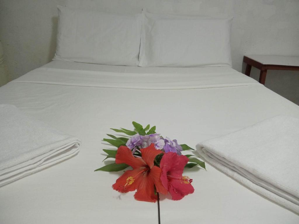 Postel nebo postele na pokoji v ubytování Kathy B Guesthouse