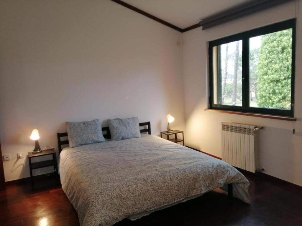 Postel nebo postele na pokoji v ubytování À Beira Lago - Casa de férias