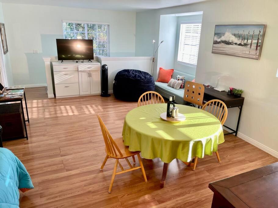 a living room with a yellow table and chairs at Santa Barbara Serenity Large 1-bedroom Guest Apt. in Santa Barbara