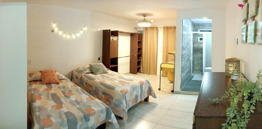 En eller flere senge i et værelse på CASA SAMANTA