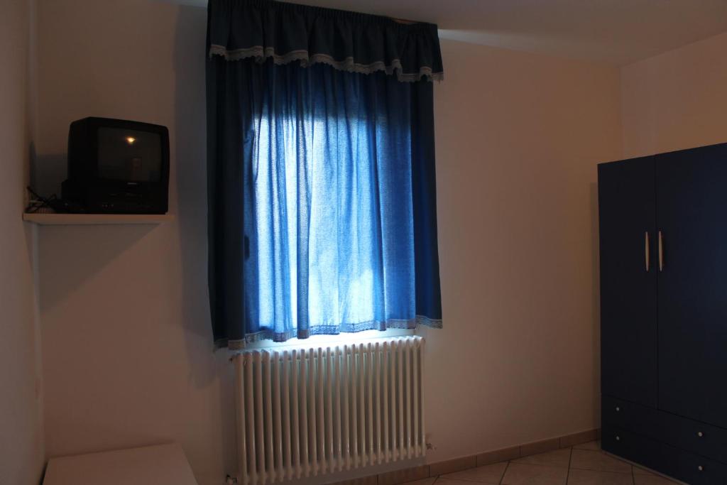 Telewizja i/lub zestaw kina domowego w obiekcie Agriturismo Le Casette
