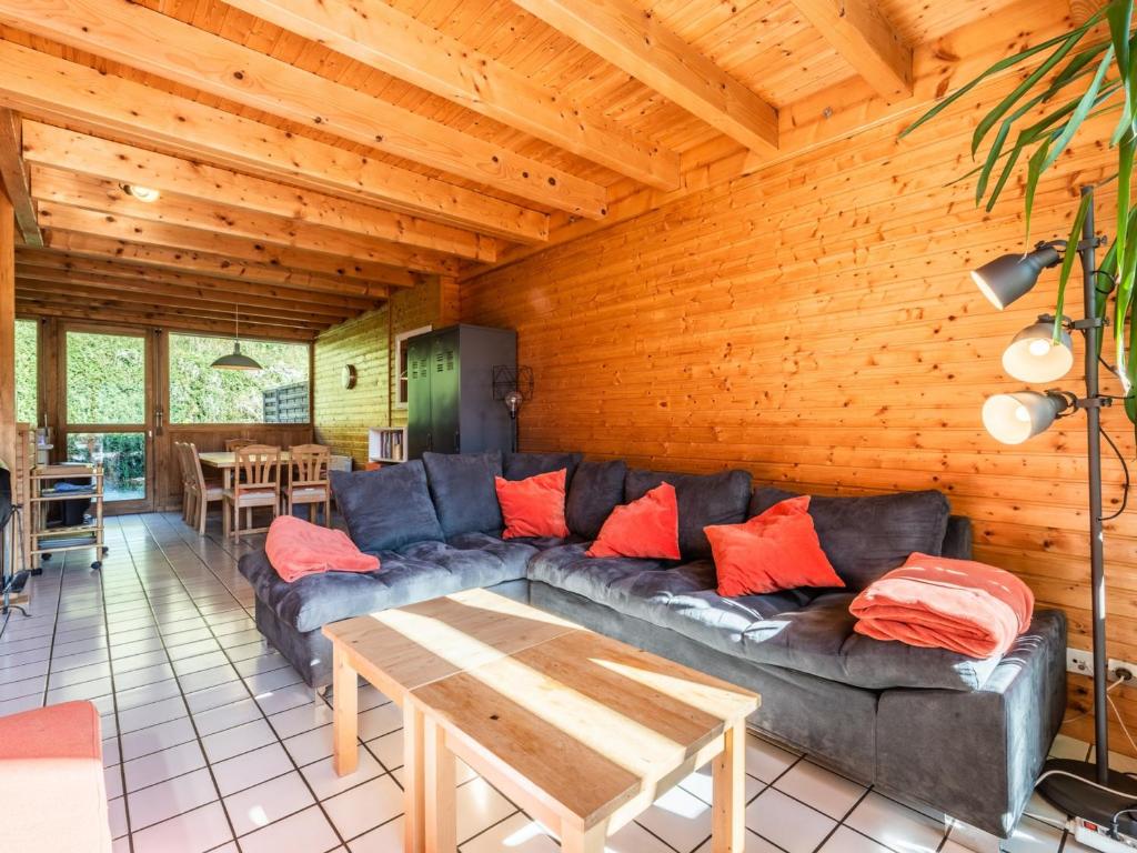 a living room with a couch and a table at Chalet Les Gets, 3 pièces, 8 personnes - FR-1-671-126 in Les Gets