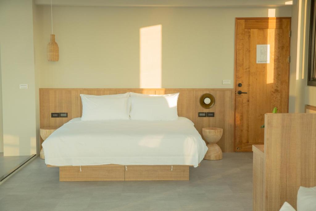 Postel nebo postele na pokoji v ubytování Golden Harvest Homestay