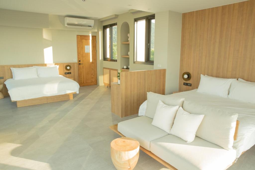Postel nebo postele na pokoji v ubytování Golden Harvest Homestay