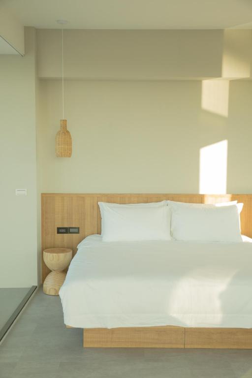Postel nebo postele na pokoji v ubytování Golden Harvest Homestay