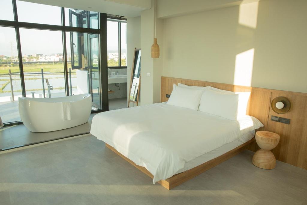 Postel nebo postele na pokoji v ubytování Golden Harvest Homestay