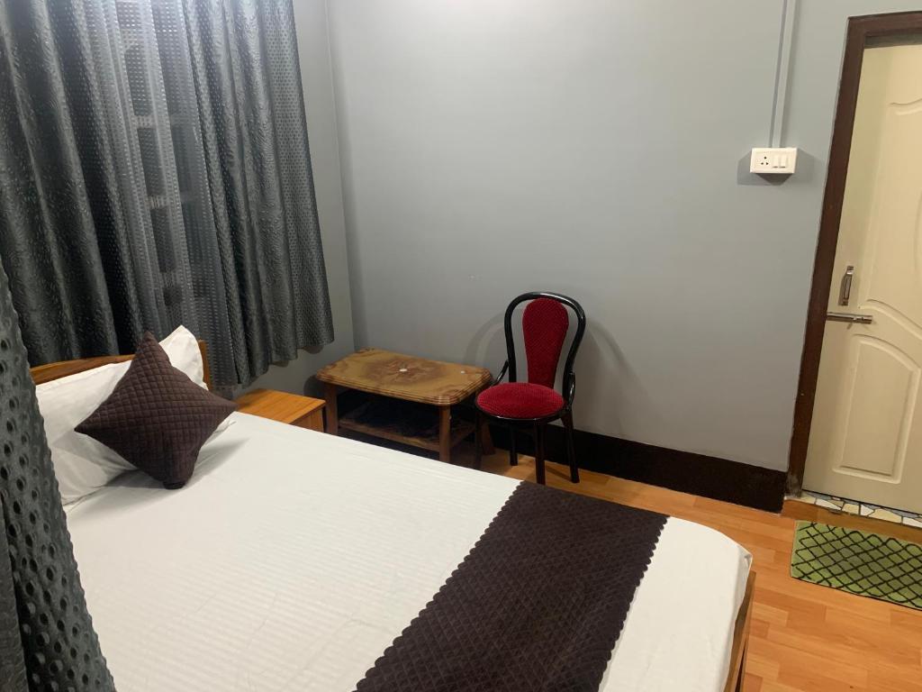 Postel nebo postele na pokoji v ubytování Aama Home Stay