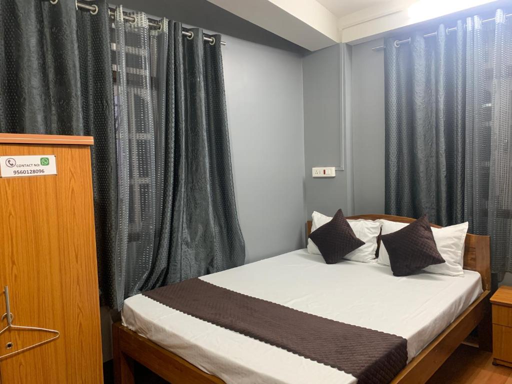 Postel nebo postele na pokoji v ubytování Aama Home Stay