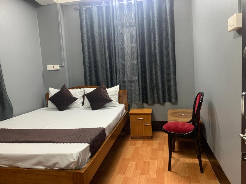 Postel nebo postele na pokoji v ubytování Aama Home Stay