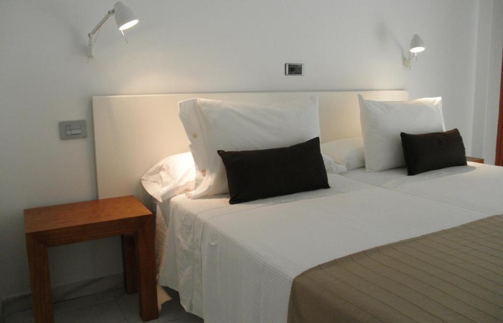 Кровать или кровати в номере Hotel Farsund