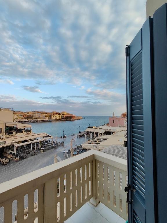 a view of the ocean from a balcony at Old Port - Bellavista Studio in Chania