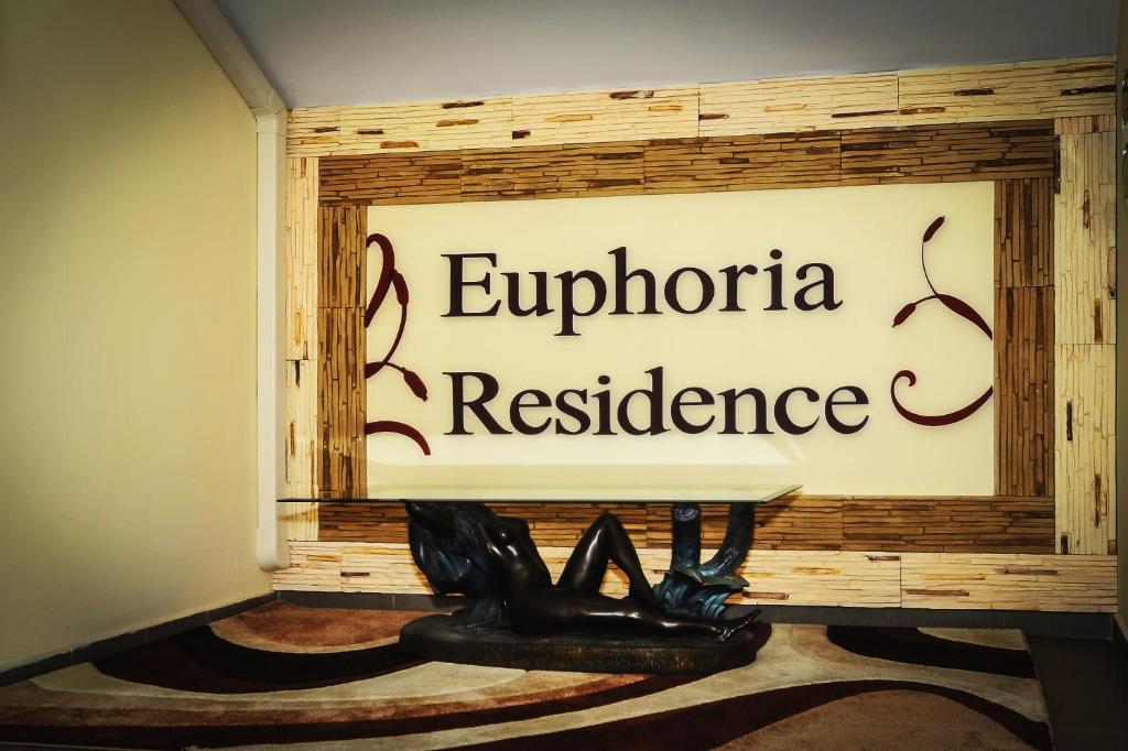 a sign for the equatorator resilience institute in a room at Euphoria Residence in Sosnowiec