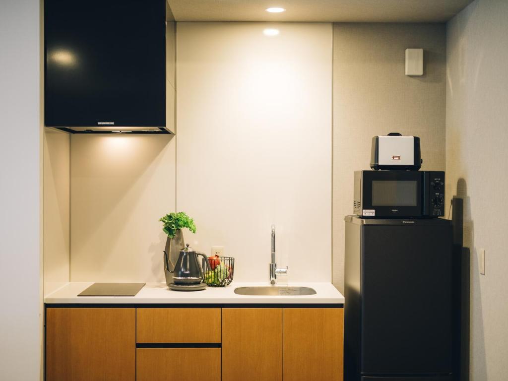 Kuchyň nebo kuchyňský kout v ubytování MIMARU SUITES Kyoto Shijo