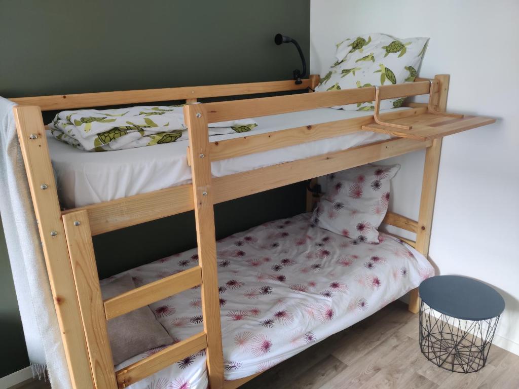 a couple of bunk beds in a room at Appartement NATURA 2 chambres in Vitré