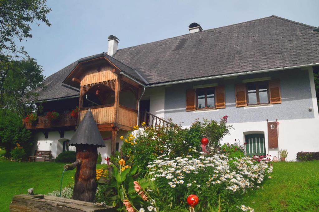 a house with a bird feeder in front of it at Ferienhaus Masser 