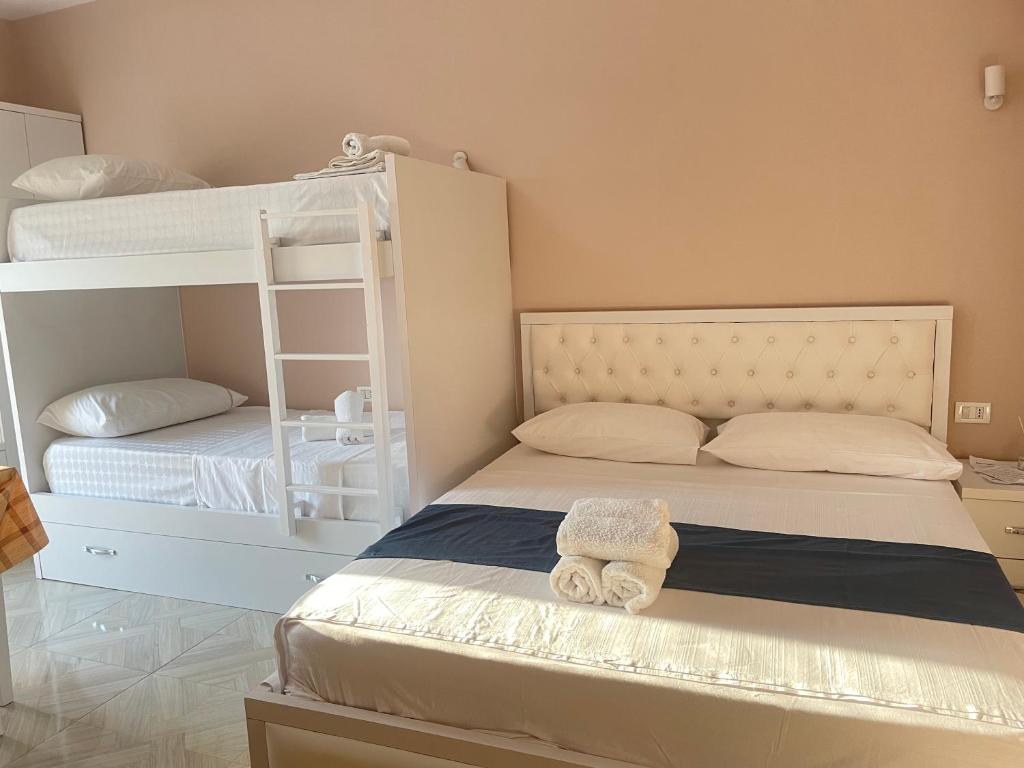 Postel nebo postele na pokoji v ubytování Vila Zini