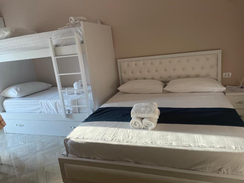 Postel nebo postele na pokoji v ubytování Vila Zini