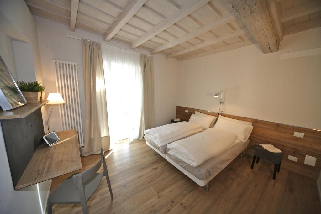 Posteľ alebo postele v izbe v ubytovaní 32 BnB Camerecaffè