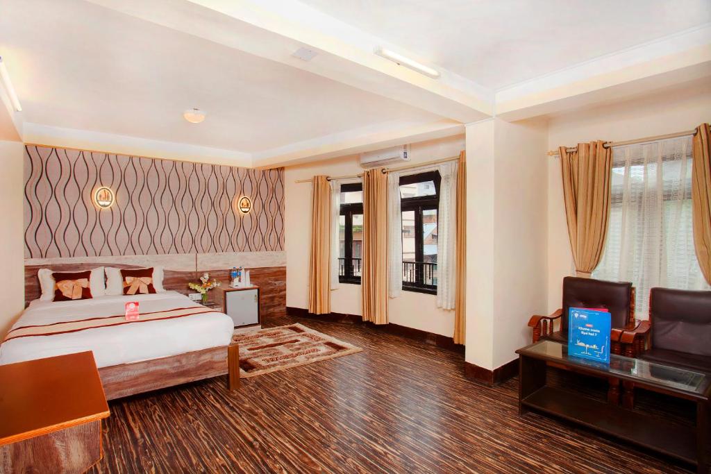 Postel nebo postele na pokoji v ubytování OYO 167 Hotel Lotus Buddha Inn
