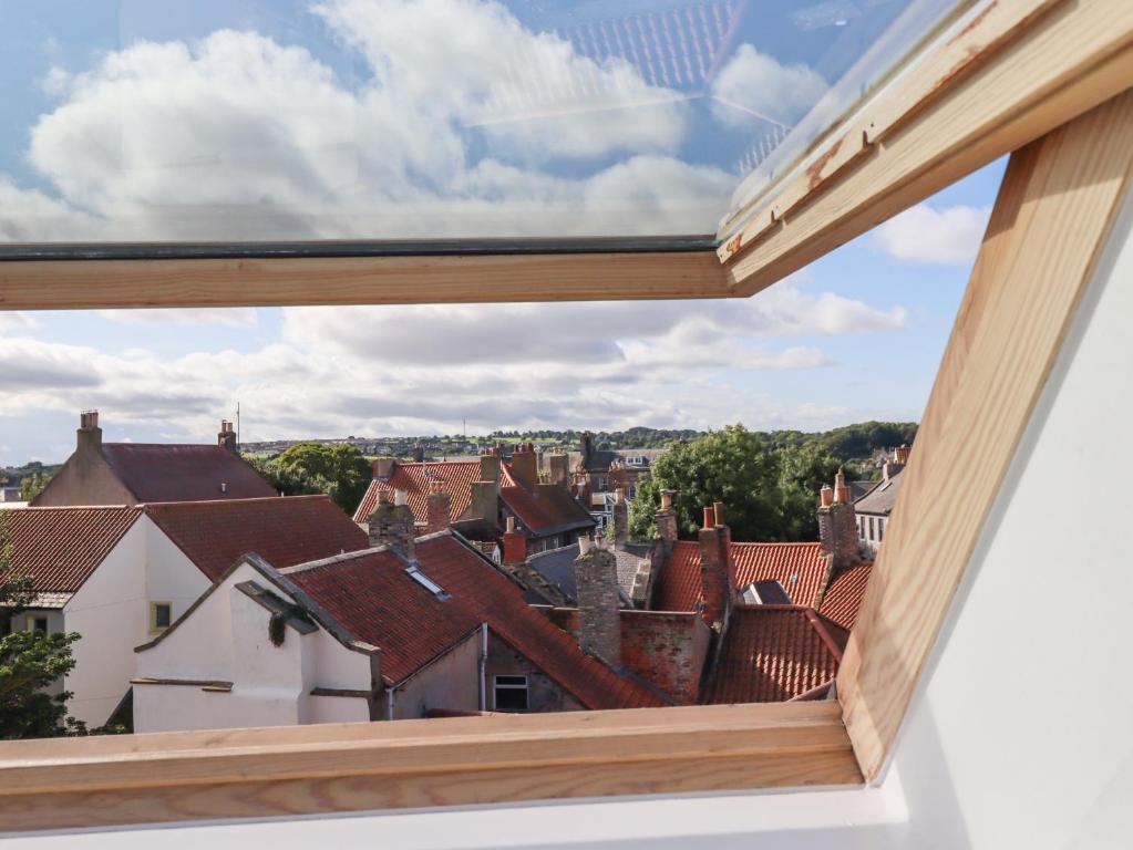 a view of the roofs of the city from a window at 18 The Old Corn Exchange in Berwick-Upon-Tweed