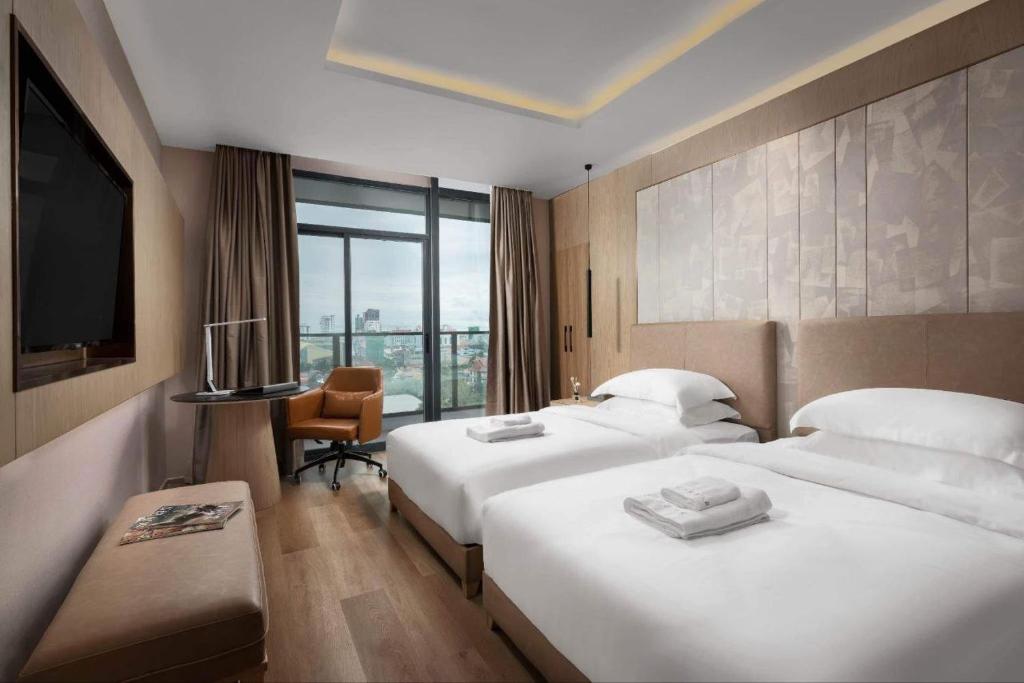 Postel nebo postele na pokoji v ubytování SF HOTEL Penthouse Residences